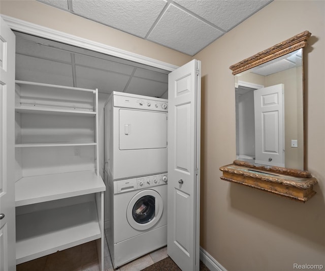 17747 Parkshore Dr, Northville, MI 48168 - laundry room featuring stacked washer and clothes dryer and baseboards