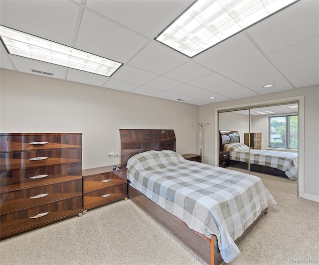 17747 Parkshore Dr, Northville, MI 48168 - bedroom with carpet floors, a paneled ceiling, and a closet