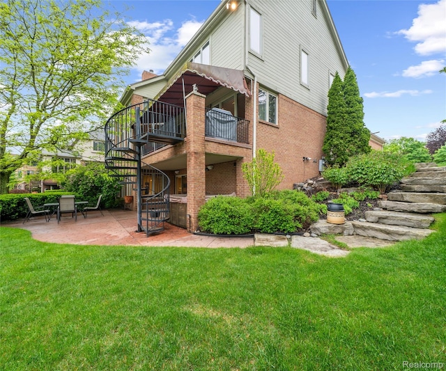 17747 Parkshore Dr, Northville, MI 48168 - back of house featuring stairway, a patio, a yard, and brick siding