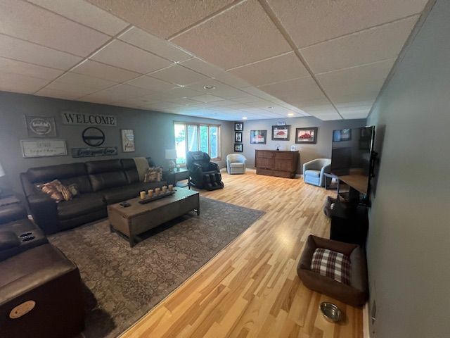 6600 Park Valley Dr, Clarkston, MI 48348 - living area featuring wood finished floors and a paneled ceiling