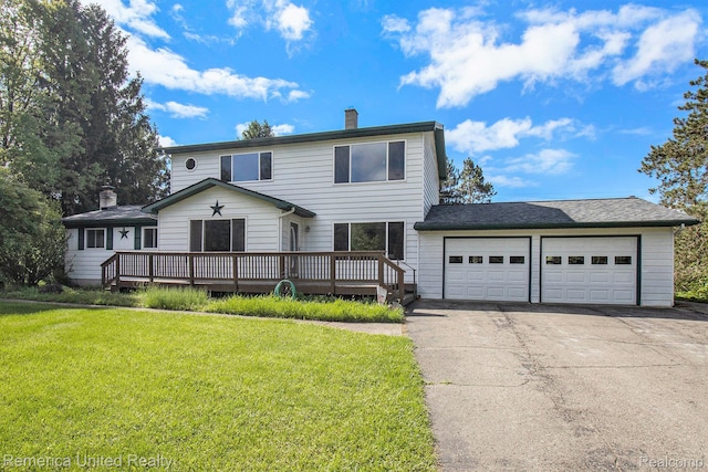400 E Schafer Rd, Pinckney, MI 48169 - traditional home with a chimney, an attached garage, driveway, and a deck