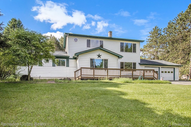 400 E Schafer Rd, Pinckney, MI 48169 - rear view of house with a chimney, driveway, a deck, an attached garage, and a yard