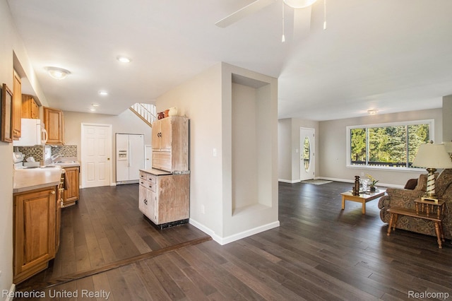 400 E Schafer Rd, Pinckney, MI 48169 - kitchen featuring light countertops, dark wood-style floors, a ceiling fan, tasteful backsplash, and recessed lighting