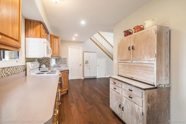 400 E Schafer Rd, Pinckney, MI 48169 - kitchen featuring white appliances, backsplash, dark wood finished floors, light countertops, and recessed lighting