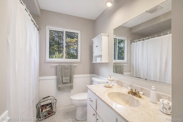 400 E Schafer Rd, Pinckney, MI 48169 - bathroom with vanity, wainscoting, tile patterned flooring, and a shower with curtain