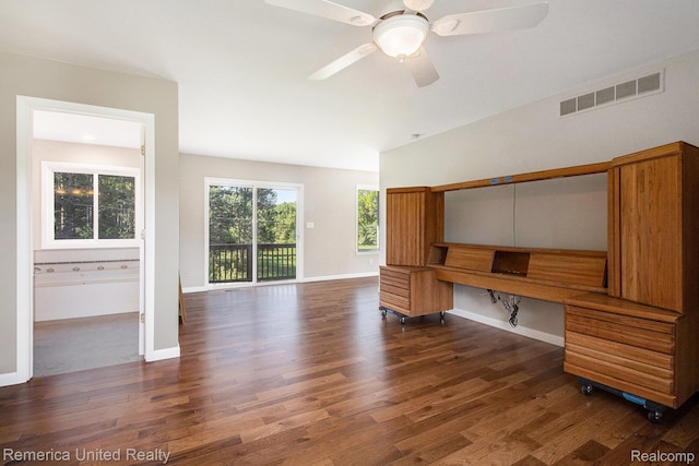 400 E Schafer Rd, Pinckney, MI 48169 - unfurnished office featuring dark wood finished floors, a ceiling fan, and built in desk