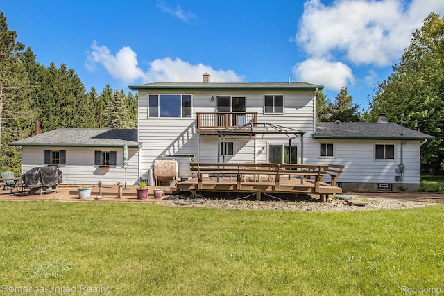400 E Schafer Rd, Pinckney, MI 48169 - back of house with a chimney, a wooden deck, and a lawn