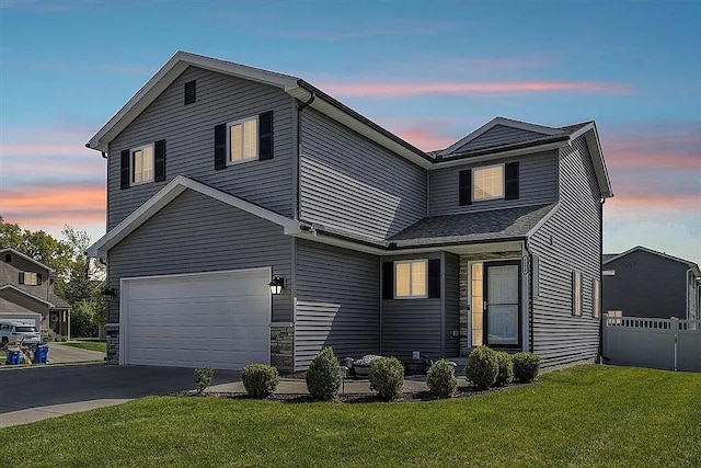 6576 Skylar Ln, Waterford, MI 48327 - traditional home featuring an attached garage and asphalt driveway