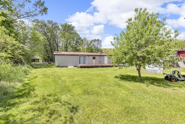 3749 Wellman Rd, Parma, MI 49269 - view of grassy yard featuring a deck