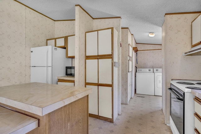 3749 Wellman Rd, Parma, MI 49269 - kitchen featuring wallpapered walls, white appliances, independent washer and dryer, light flooring, and a textured ceiling