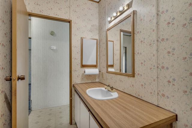 3749 Wellman Rd, Parma, MI 49269 - bathroom with tile patterned floors, vanity, and wallpapered walls
