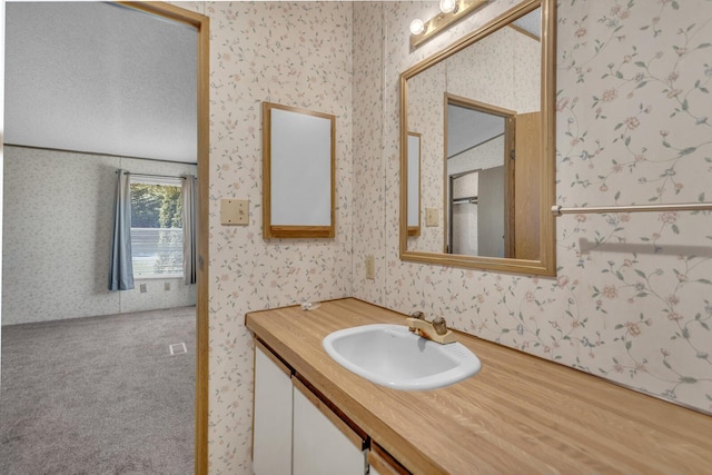 3749 Wellman Rd, Parma, MI 49269 - bathroom with wallpapered walls and vanity