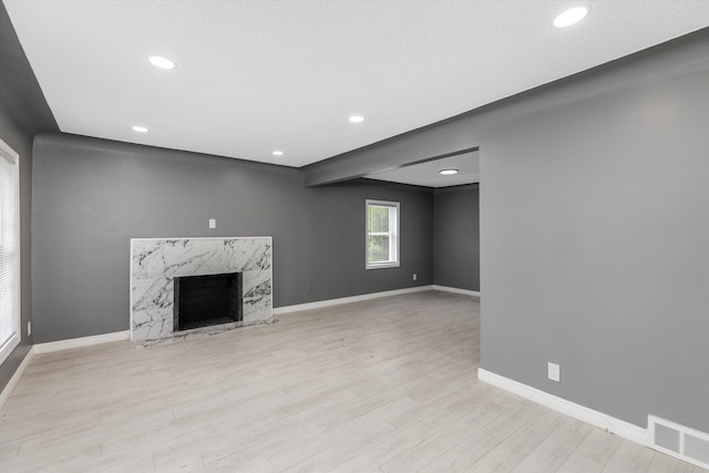 15770 Mansfield St, Detroit, MI 48227 - unfurnished living room with wood finished floors, baseboards, recessed lighting, and a fireplace