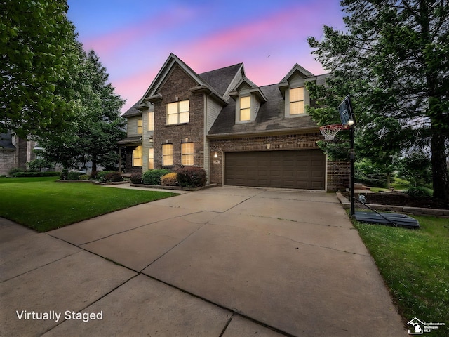469 Corinth Cir, Dundee, MI 48131 - traditional home with a garage, brick siding, concrete driveway, a lawn, and a shingled roof