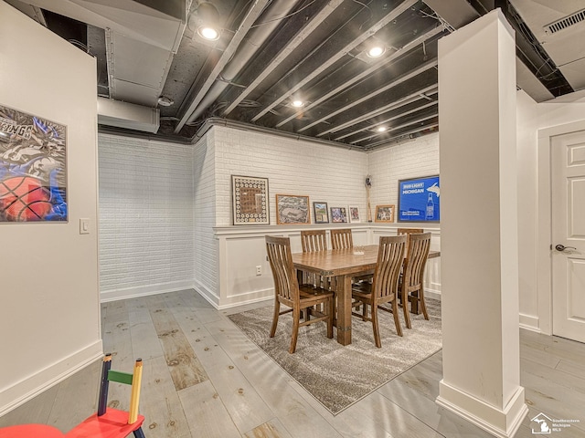 469 Corinth Cir, Dundee, MI 48131 - dining room with wood finished floors and brick wall