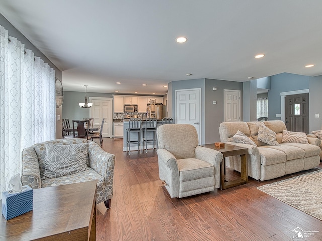 469 Corinth Cir, Dundee, MI 48131 - living area with dark wood-style floors, recessed lighting, and a chandelier