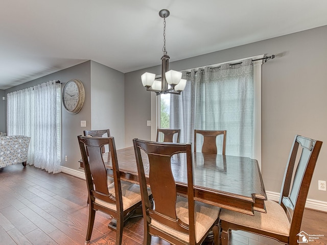 469 Corinth Cir, Dundee, MI 48131 - dining area with a chandelier, wood finished floors, and baseboards