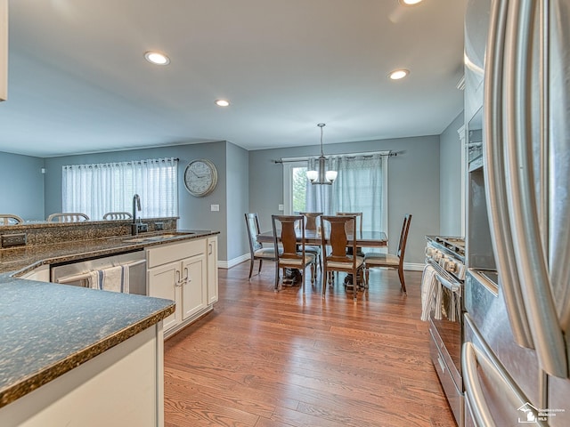 469 Corinth Cir, Dundee, MI 48131 - kitchen with appliances with stainless steel finishes, a sink, recessed lighting, baseboards, and white cabinets