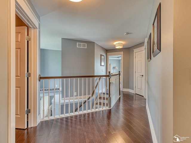 469 Corinth Cir, Dundee, MI 48131 - hall featuring an upstairs landing, wood finished floors, and baseboards