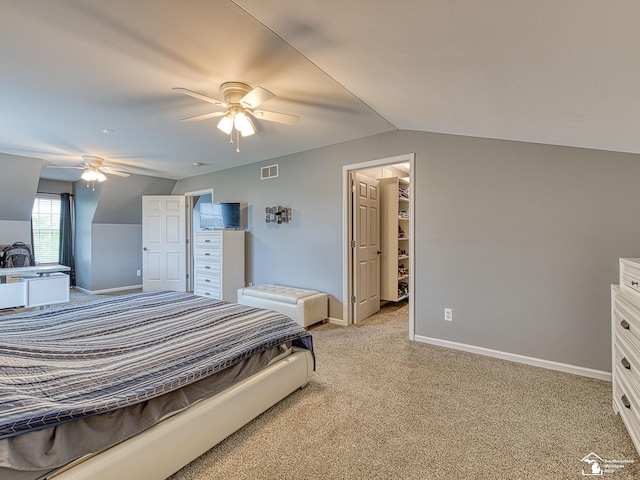 469 Corinth Cir, Dundee, MI 48131 - bedroom featuring lofted ceiling, light carpet, baseboards, a spacious closet, and a ceiling fan