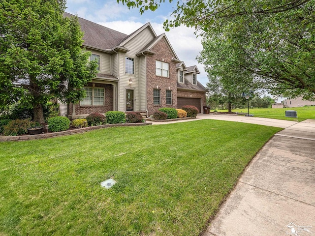 469 Corinth Cir, Dundee, MI 48131 - view of front of home with concrete driveway, brick siding, a garage, and a front yard