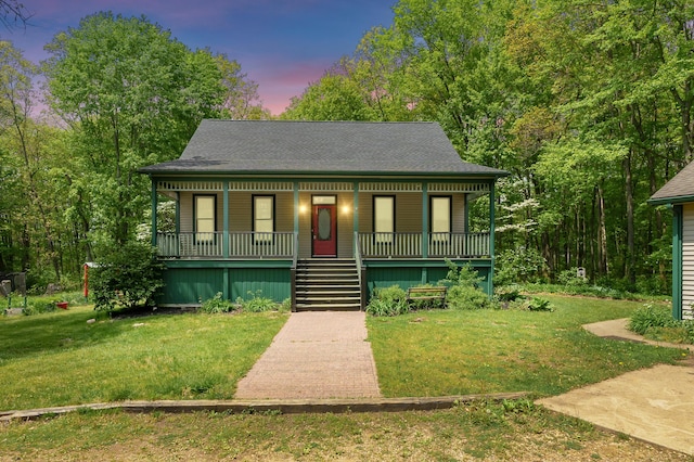 9934 W Fg Ave, Kalamazoo, MI 49009 - view of front of home featuring covered porch, stairway, a lawn, and roof with shingles