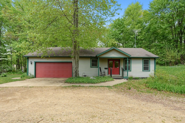 9934 W Fg Ave, Kalamazoo, MI 49009 - view of front of property featuring driveway, a garage, and a shingled roof