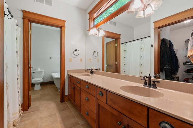 9934 W Fg Ave, Kalamazoo, MI 49009 - full bath with tile patterned floors, double vanity, and toilet