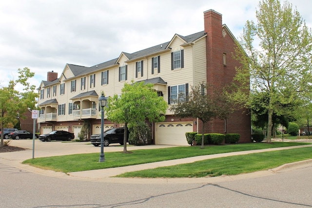 45862 S Stonewood Rd Unit 218, Canton, MI 48187 - townhome / multi-family property featuring an attached garage, a front lawn, and brick siding
