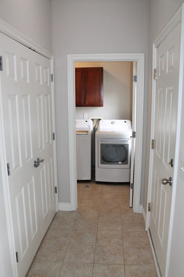 45862 S Stonewood Rd Unit 218, Canton, MI 48187 - washroom featuring washer and clothes dryer, cabinet space, light tile patterned flooring, and baseboards