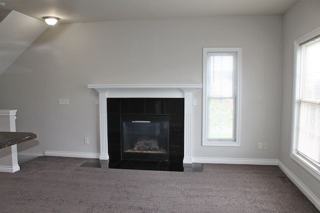 45862 S Stonewood Rd Unit 218, Canton, MI 48187 - detailed view of carpet floors, a tiled fireplace, and baseboards