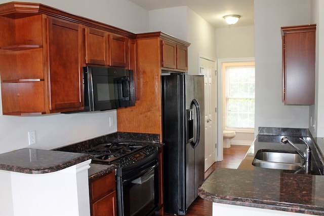 45862 S Stonewood Rd Unit 218, Canton, MI 48187 - kitchen featuring black appliances, a sink, open shelves, dark wood-type flooring, and brown cabinets