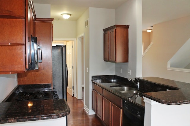 45862 S Stonewood Rd Unit 218, Canton, MI 48187 - kitchen with black appliances, a sink, dark wood finished floors, and dark stone countertops
