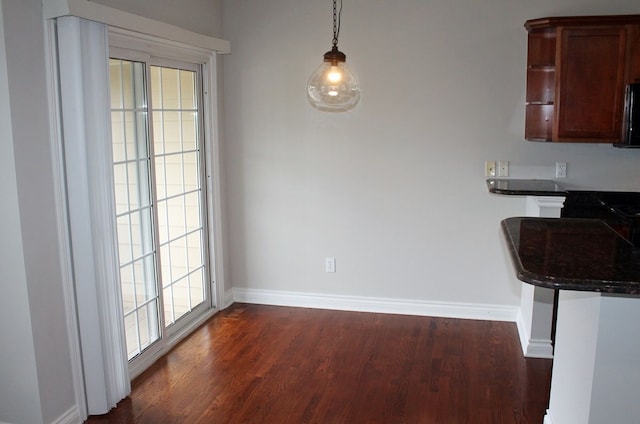 45862 S Stonewood Rd Unit 218, Canton, MI 48187 - dining room featuring dark wood-style flooring and baseboards