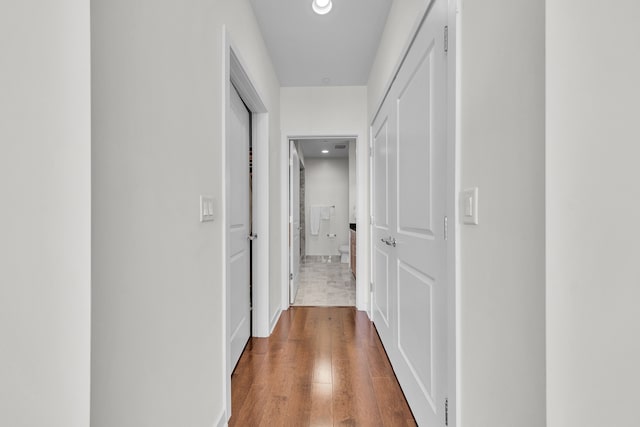1135 Shelby St Unit 59-2808, Detroit, MI 48226 - hallway featuring wood finished floors, recessed lighting, and baseboards