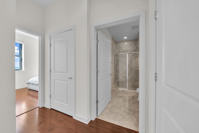1135 Shelby St Unit 59-2808, Detroit, MI 48226 - hallway featuring wood finished floors and baseboards