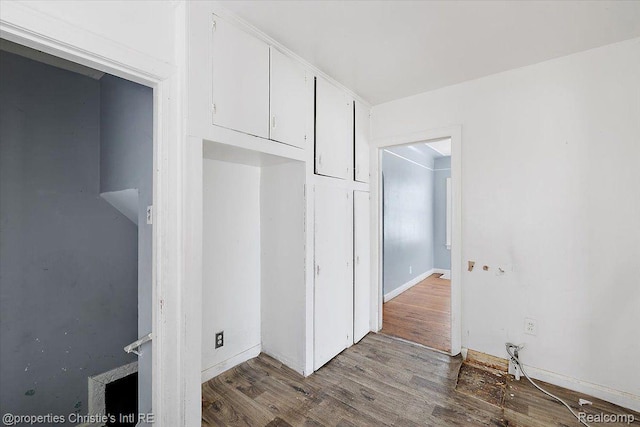 19479 Helen St, Detroit, MI 48234 - unfurnished bedroom with wood finished floors and baseboards