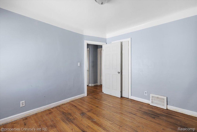 19479 Helen St, Detroit, MI 48234 - empty room with baseboards and wood finished floors