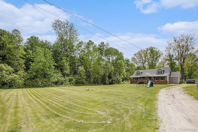 6621 Dove Rd, Kimball, MI 48074 - view of grassy yard featuring a wooden deck
