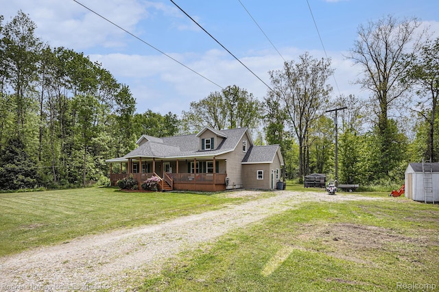 6621 Dove Rd, Kimball, MI 48074 - view of front facade with driveway, covered porch, a front yard, and roof with shingles