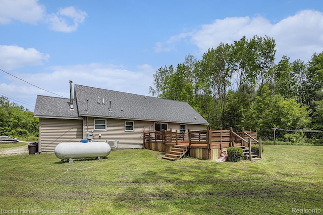 6621 Dove Rd, Kimball, MI 48074 - back of property featuring a wooden deck, a yard, a shingled roof, and cooling unit