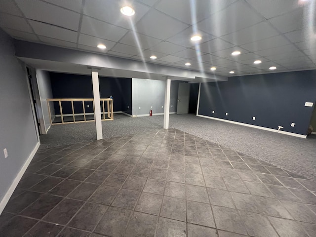 72 E Brink St, Grant, MI 49327 - finished below grade area featuring baseboards, carpet, recessed lighting, a drop ceiling, and tile patterned flooring