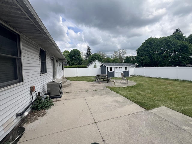 72 E Brink St, Grant, MI 49327 - view of patio / terrace featuring central AC and an outdoor structure