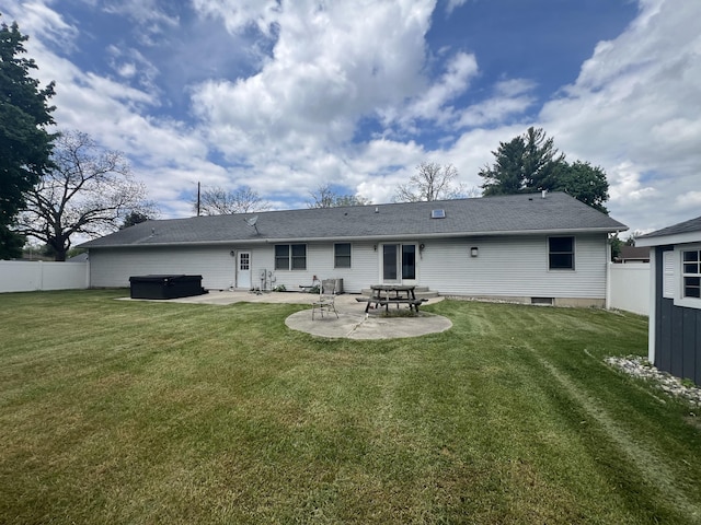 72 E Brink St, Grant, MI 49327 - back of house featuring a hot tub, a patio area, and a shingled roof