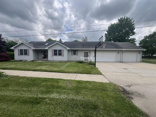 72 E Brink St, Grant, MI 49327 - ranch-style house featuring a garage, concrete driveway, and a front yard
