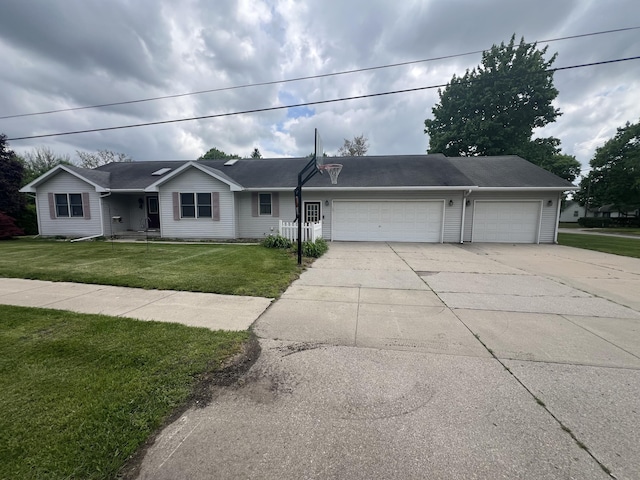 72 E Brink St, Grant, MI 49327 - ranch-style home with concrete driveway, a garage, and a front lawn
