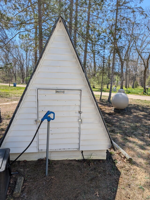 5268 S Arrowhead Trl, Baldwin, MI 49304 - view of outdoor structure featuring view of wooded area