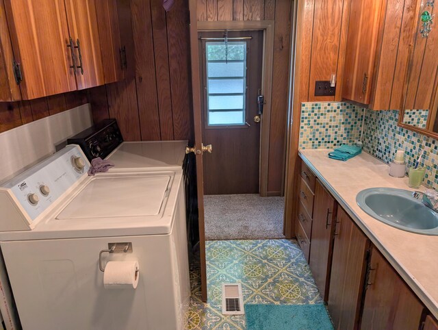 5268 S Arrowhead Trl, Baldwin, MI 49304 - clothes washing area featuring washer and clothes dryer and carpet