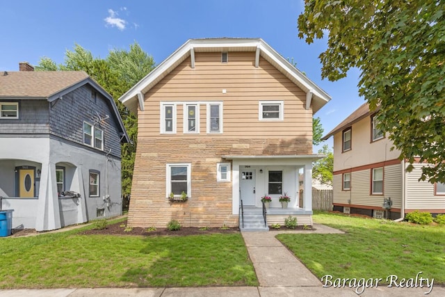 964 Lincoln Ave NW, Grand Rapids, MI 49504 - traditional-style home with a front lawn and stone siding