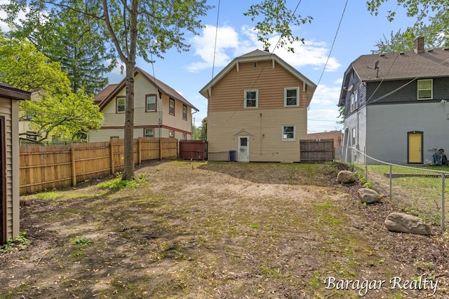 964 Lincoln Ave NW, Grand Rapids, MI 49504 - back of house with a fenced backyard